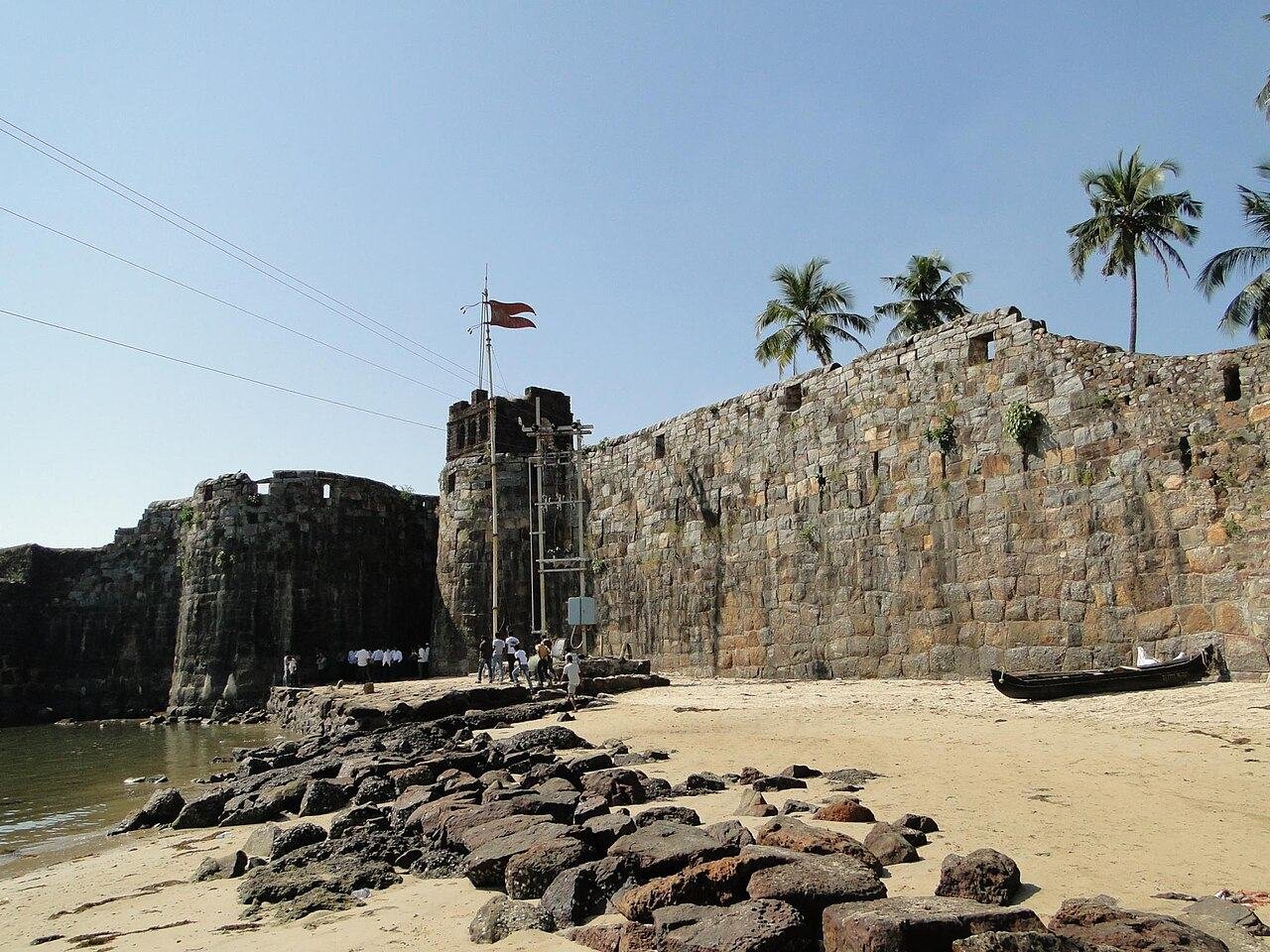 Stone walls of Sindhudurg Fort at the water's edge